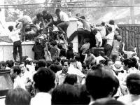 April 29, 1975, Saigon, Vietnamese enter the US Embassy
      to get to the helicopter pickup zone.